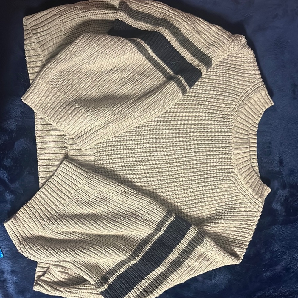 A grey knit crop top sweater with stripes
